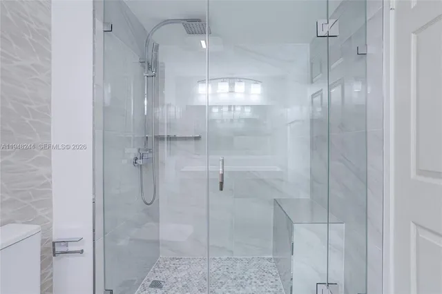 a view of a bathroom with a glass door