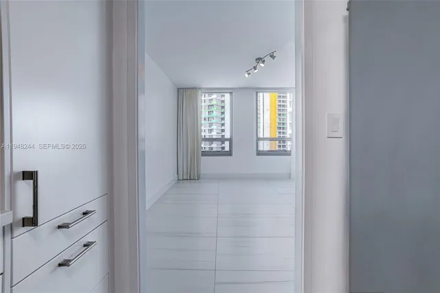 a view of hallway with closet