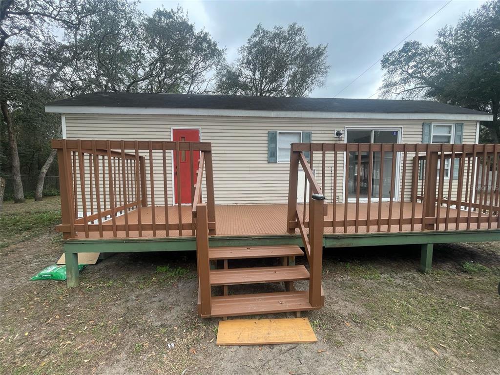 3000 Clarcona Road, Unit 830 Apopka, FL 32703 - Photo 1 of 28 a view of a wooden deck and a yard