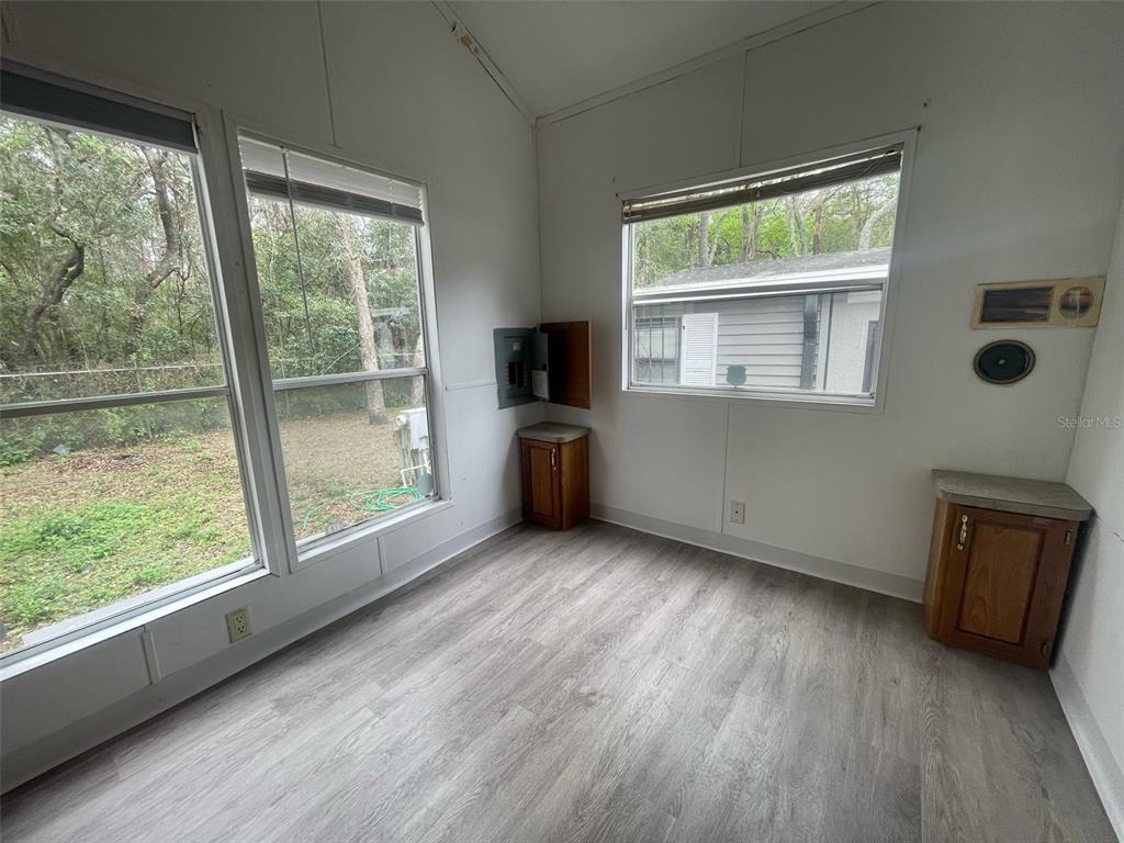 3000 Clarcona Road, Unit 830 Apopka, FL 32703 - Photo 18 of 28 an empty room with wooden floor and windows