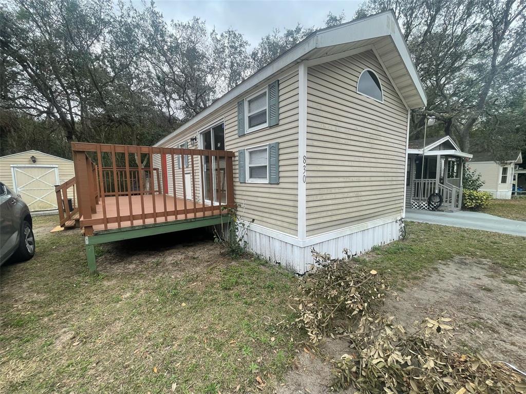 3000 Clarcona Road, Unit 830 Apopka, FL 32703 - Photo 21 of 28 a view of backyard with a small cabin