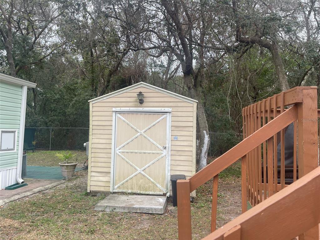 3000 Clarcona Road, Unit 830 Apopka, FL 32703 - Photo 25 of 28 a front view of a house with backyard