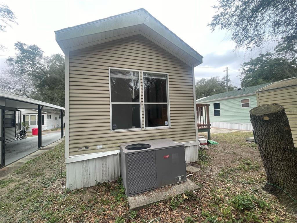 3000 Clarcona Road, Unit 830 Apopka, FL 32703 - Photo 26 of 28 a view of a house with a yard