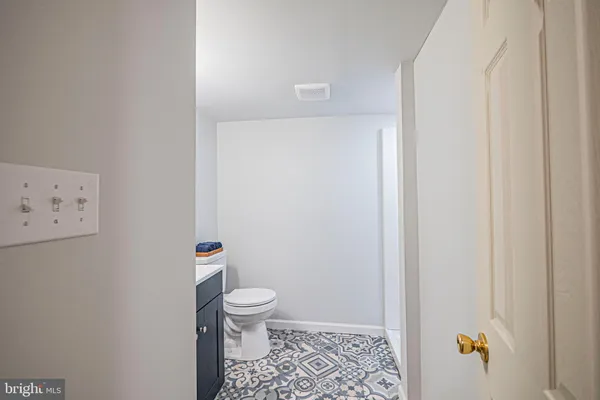 a bedroom with a bed and a bathroom