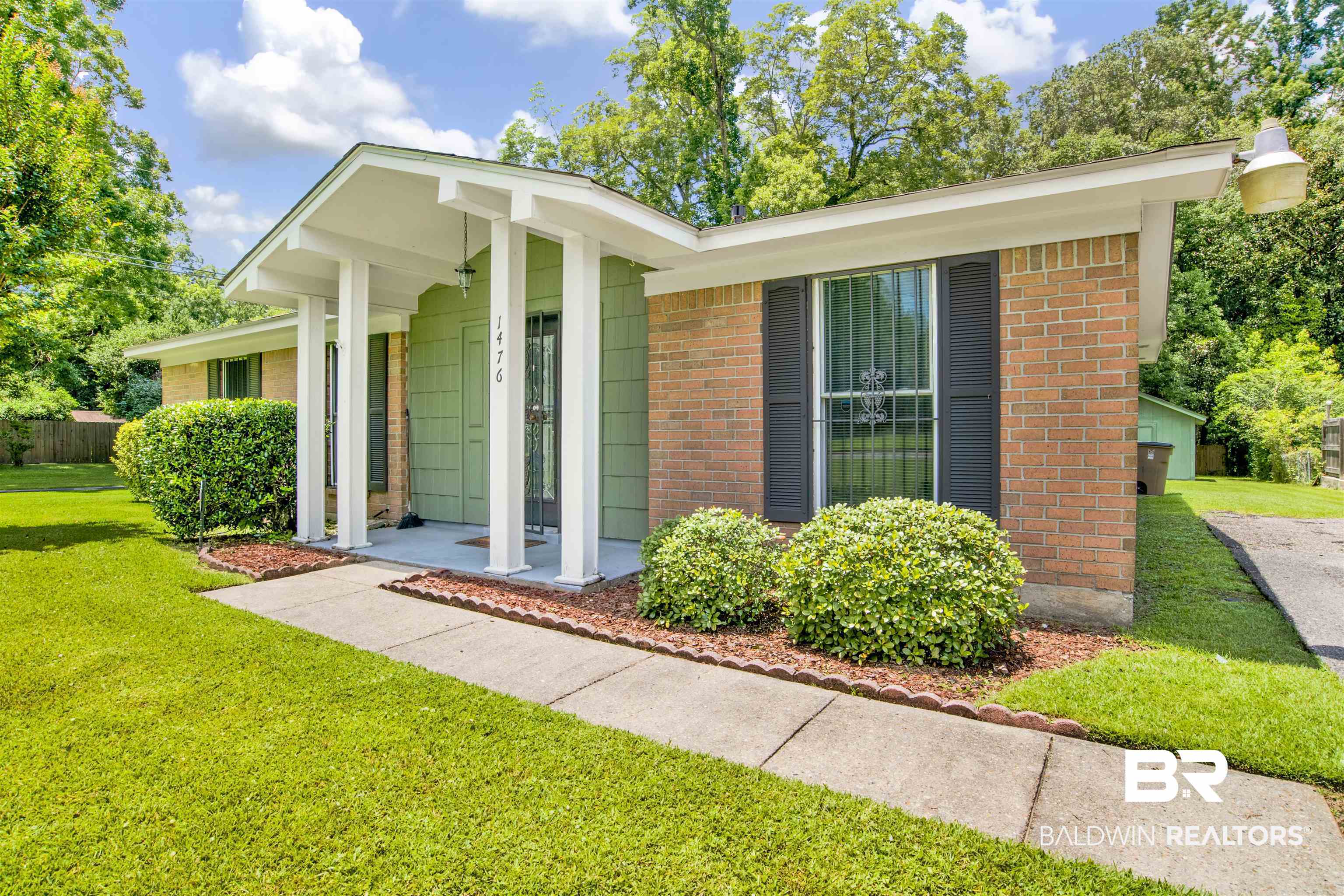 1476 Boudousquie Street Mobile, AL 36605 - Photo 2 of 34 View of front of property featuring brick siding and a front lawn