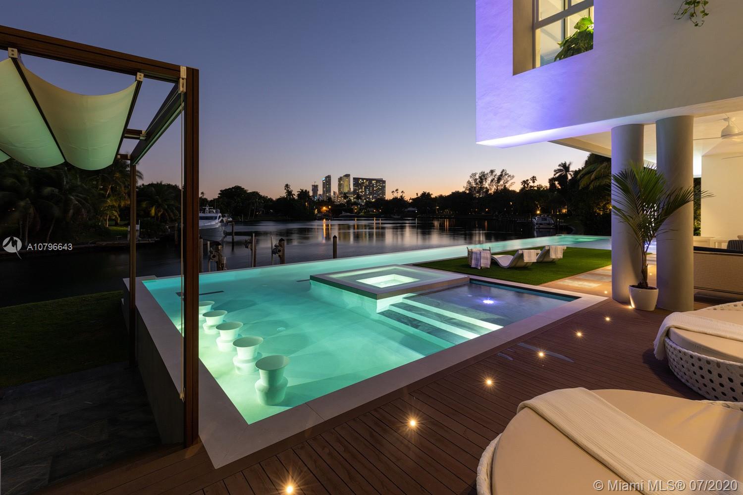 4731 Lake Road Miami, FL 33137 - Photo 1 of 46 a view of a swimming pool with a patio