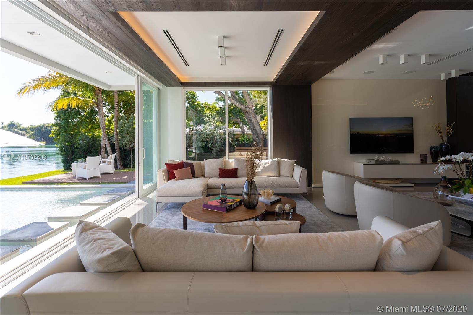 4731 Lake Road Miami, FL 33137 - Photo 13 of 46 a living room with furniture and a flat screen tv