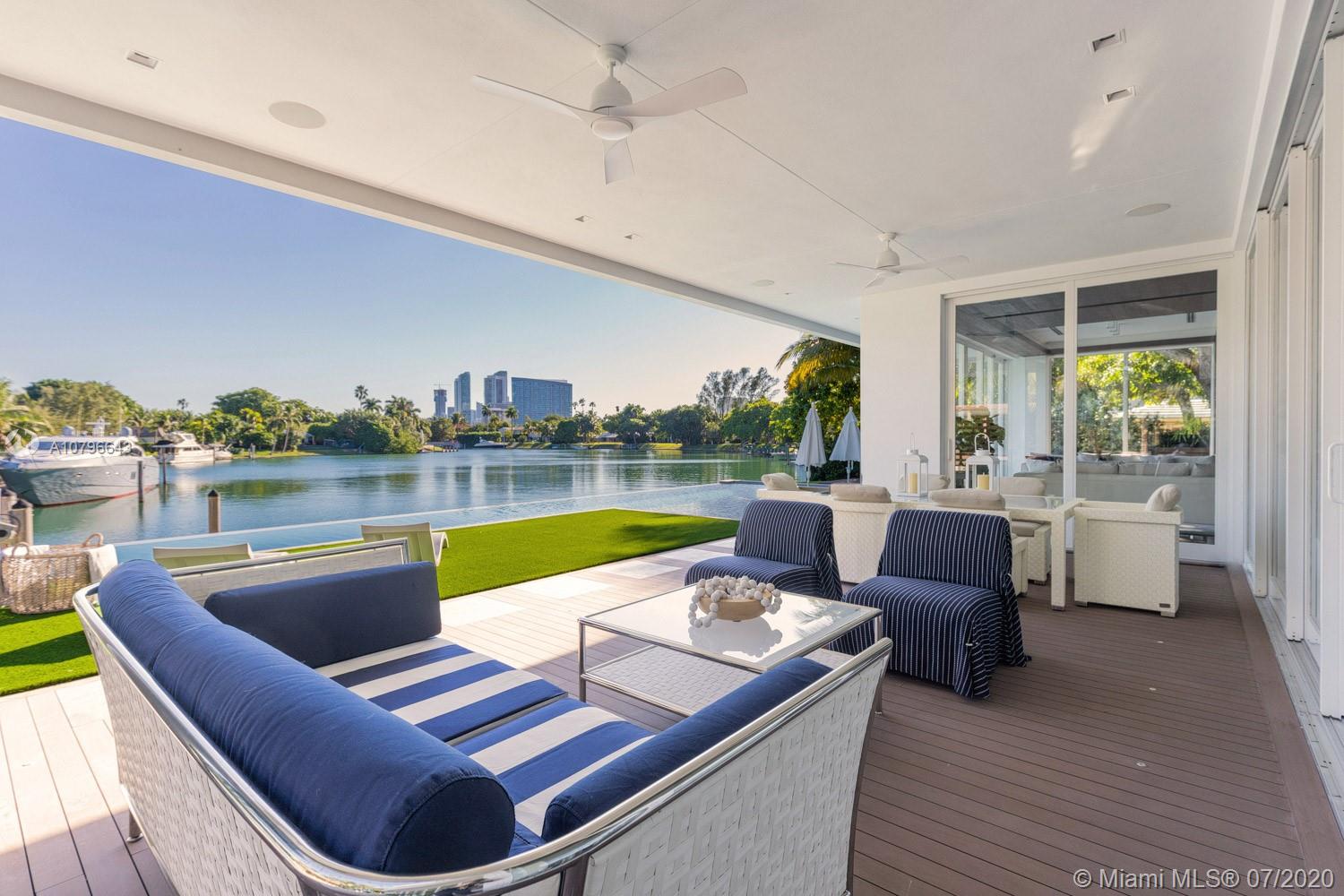 4731 Lake Road Miami, FL 33137 - Photo 16 of 46 a view of swimming pool with outdoor seating and yard in the back