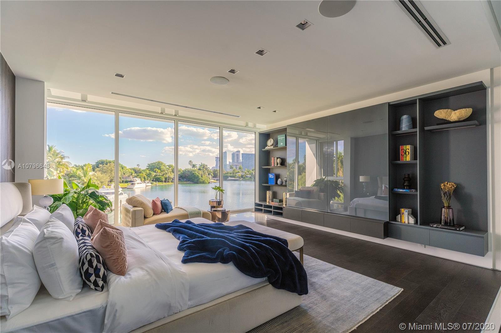 4731 Lake Road Miami, FL 33137 - Photo 18 of 46 a bed sitting in a spacious bedroom next to a window