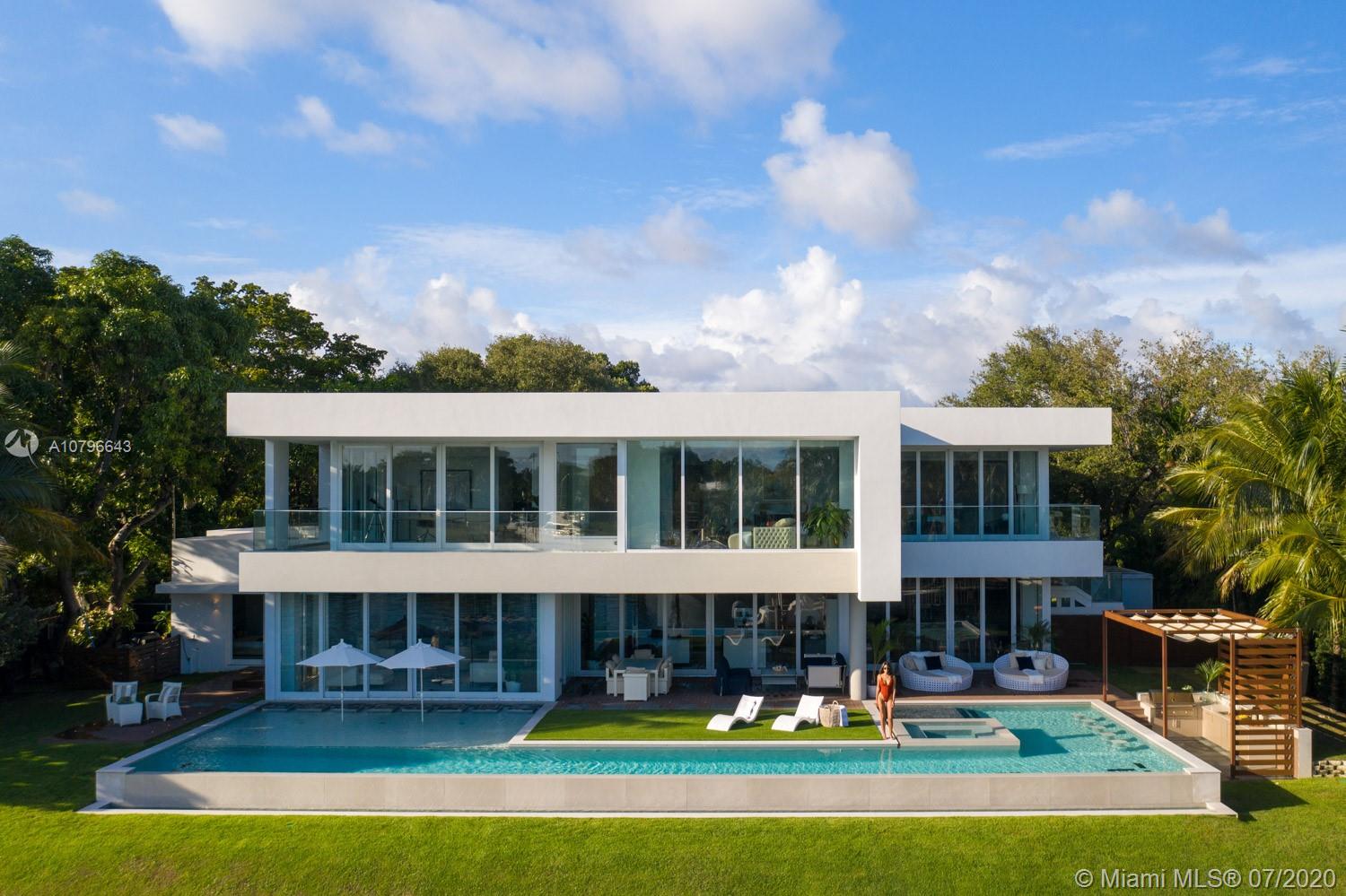 4731 Lake Road Miami, FL 33137 - Photo 3 of 46 a front view of a house with a yard