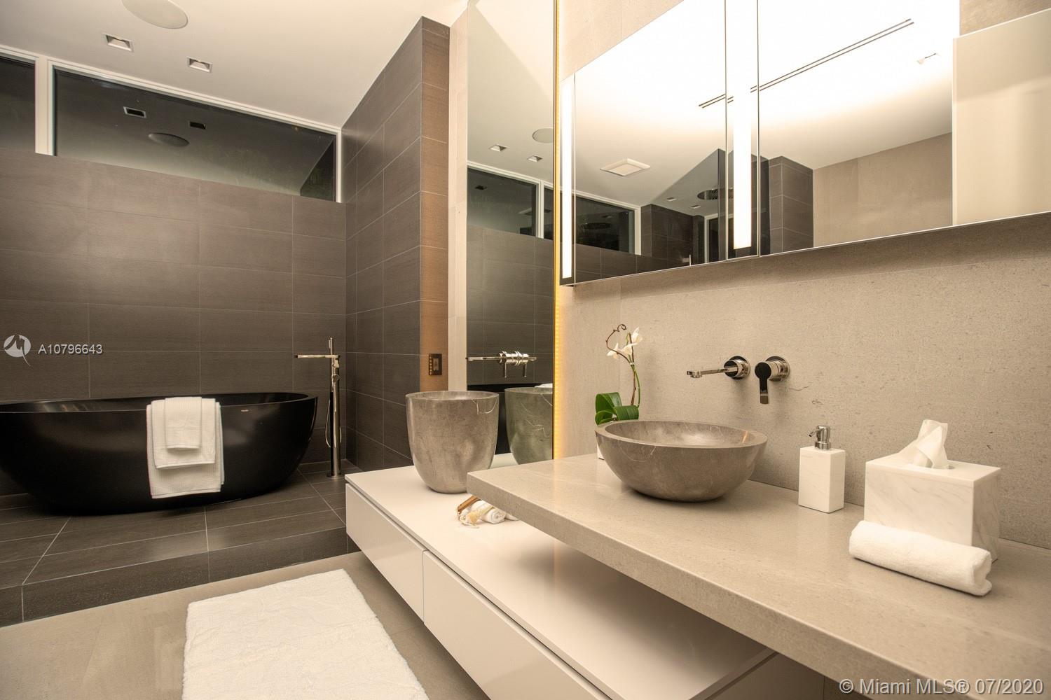 4731 Lake Road Miami, FL 33137 - Photo 21 of 46 a kitchen with cabinets and window