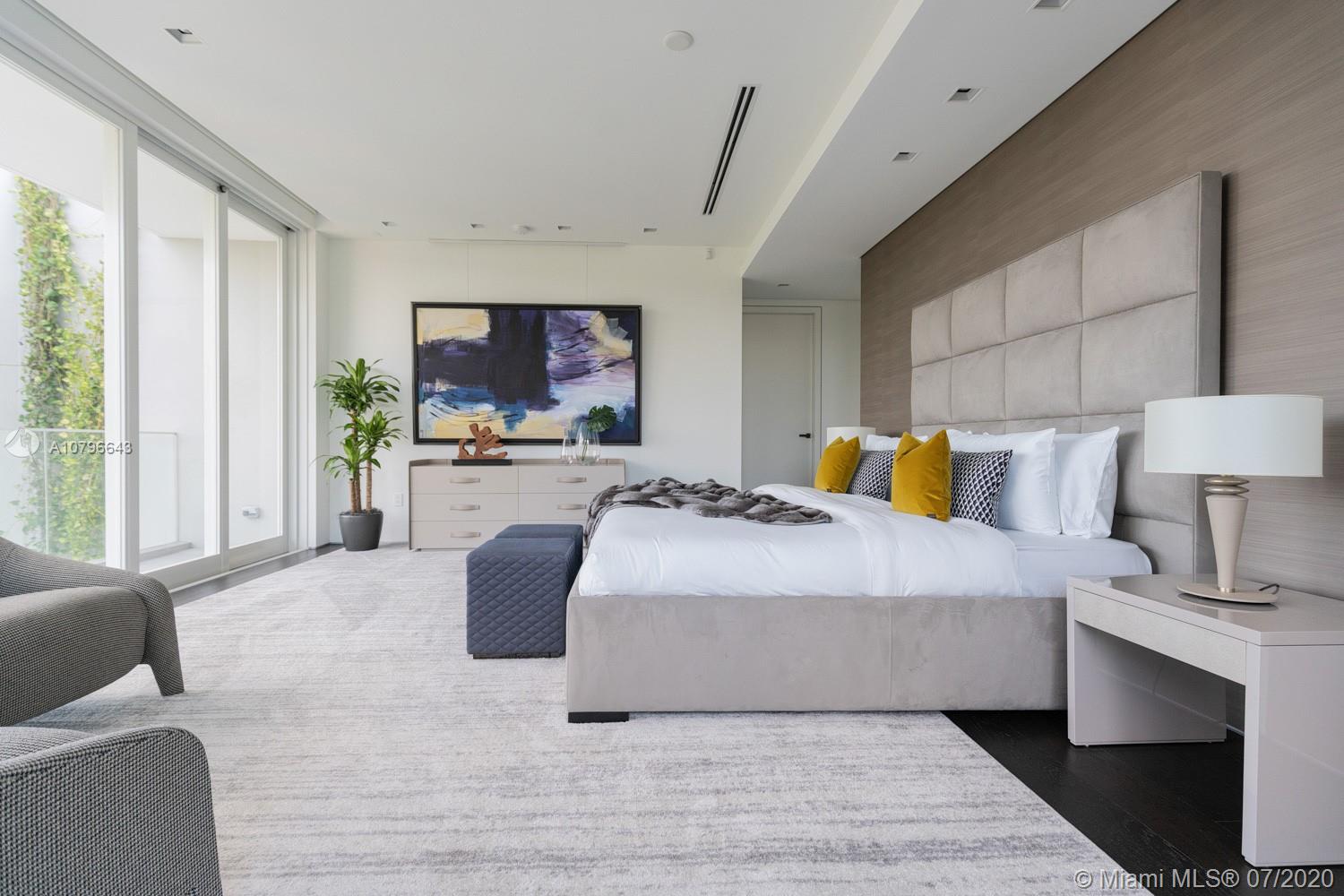 4731 Lake Road Miami, FL 33137 - Photo 26 of 46 a bedroom with a large bed and a couch