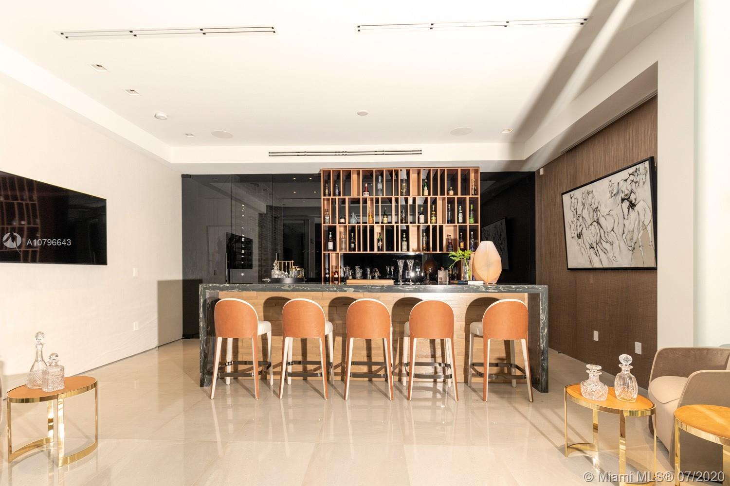 4731 Lake Road Miami, FL 33137 - Photo 28 of 46 a dining hall with stainless steel appliances kitchen island granite countertop a table and chairs