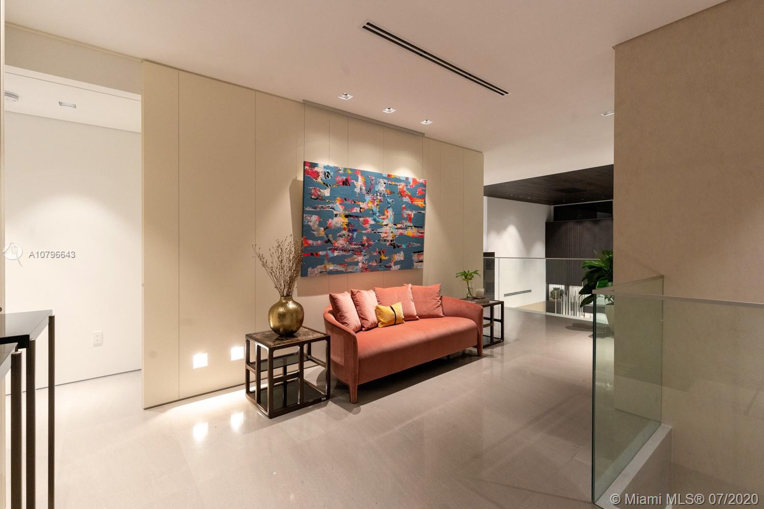 4731 Lake Road Miami, FL 33137 - Photo 31 of 46 a living room with furniture and a flat screen tv