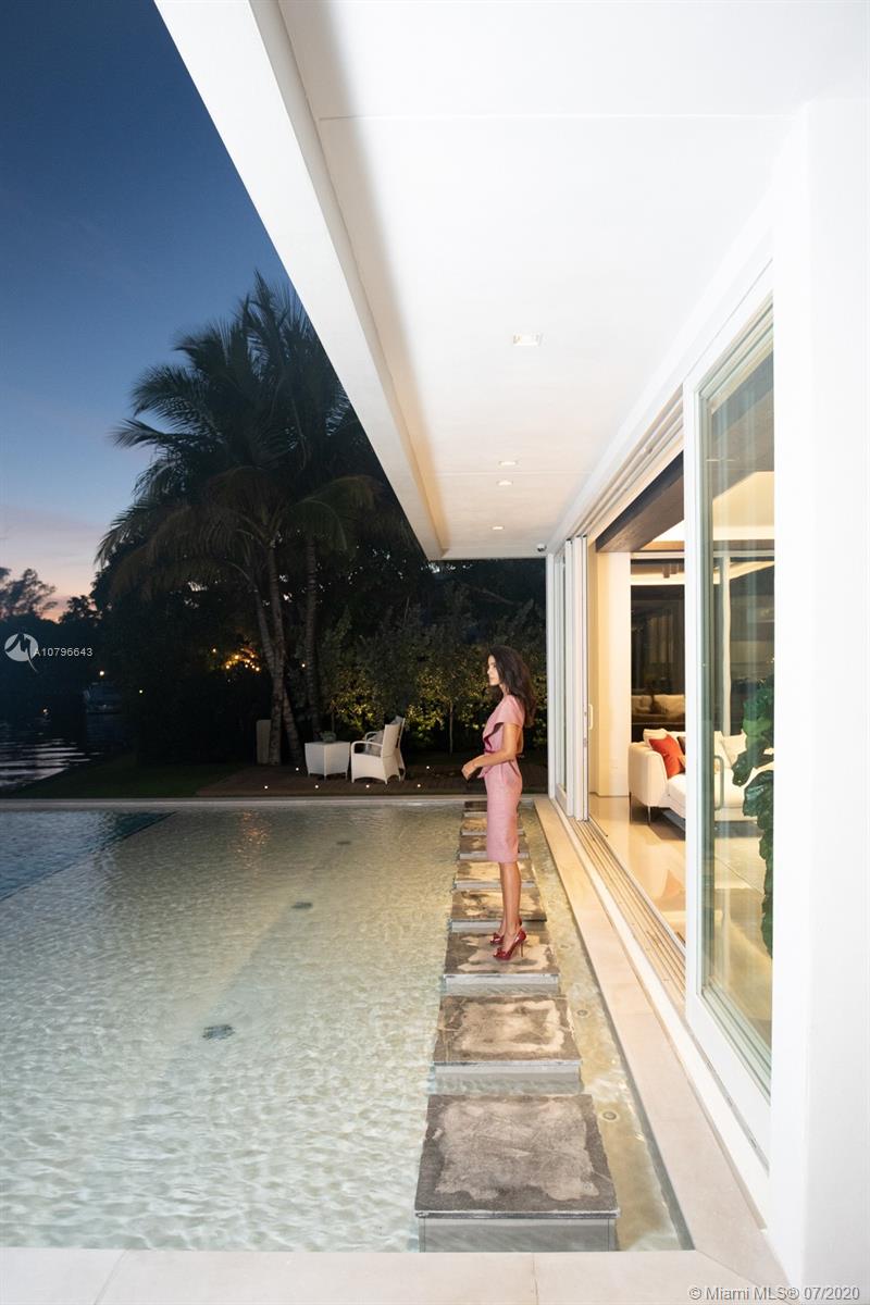 4731 Lake Road Miami, FL 33137 - Photo 34 of 46 a view of a swimming pool with a patio