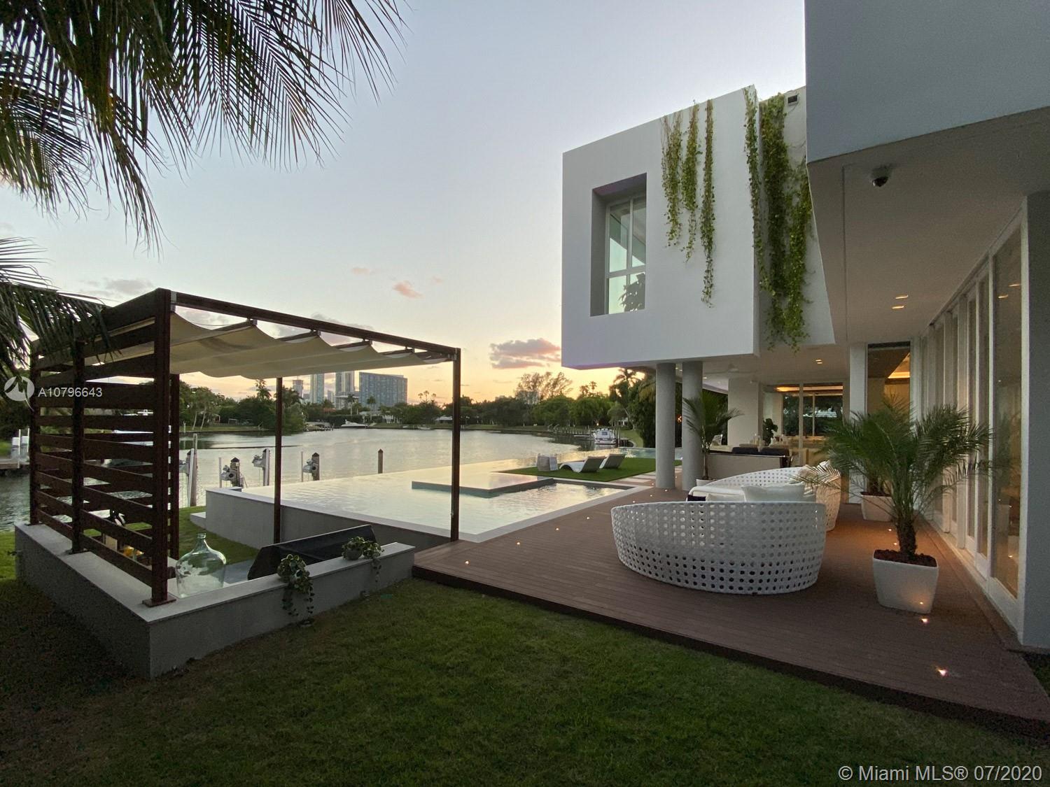 4731 Lake Road Miami, FL 33137 - Photo 37 of 46 a living room with furniture and a floor to ceiling window