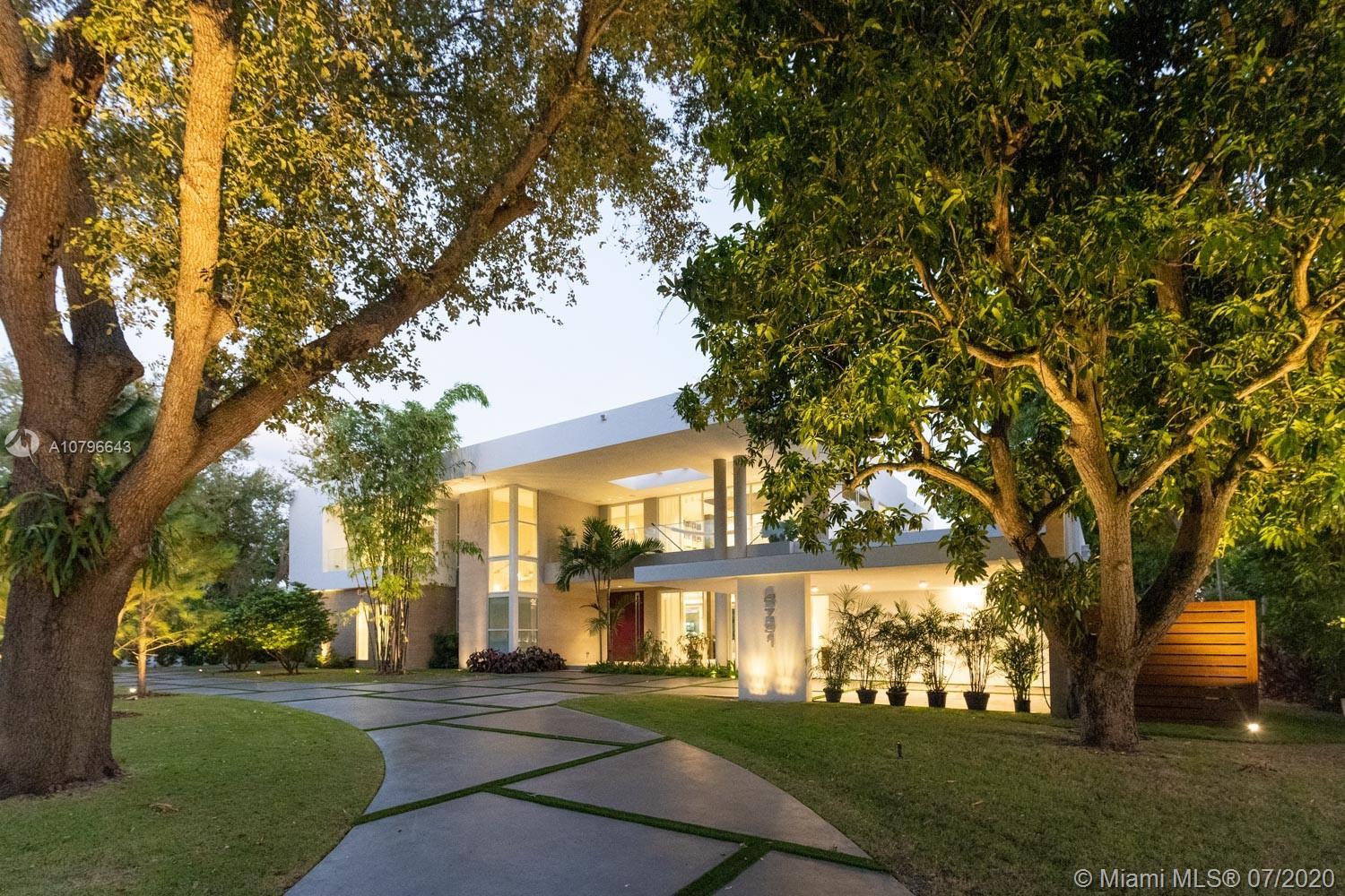 4731 Lake Road Miami, FL 33137 - Photo 39 of 46 a front view of a house with a garden