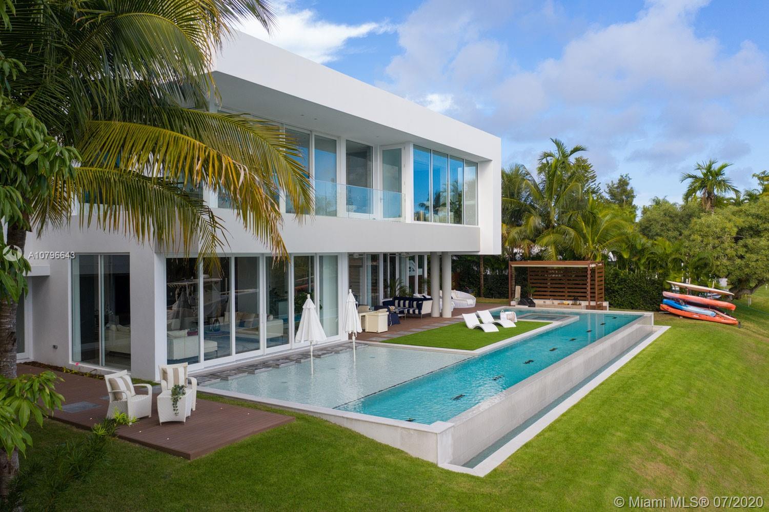 4731 Lake Road Miami, FL 33137 - Photo 43 of 46 a view of a house with swimming pool and porch with furniture