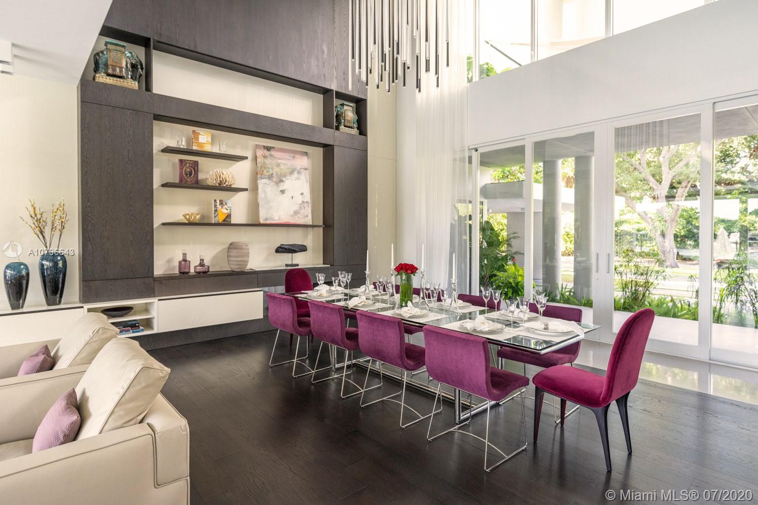 4731 Lake Road Miami, FL 33137 - Photo 9 of 46 a dining room with furniture a large window and a rug