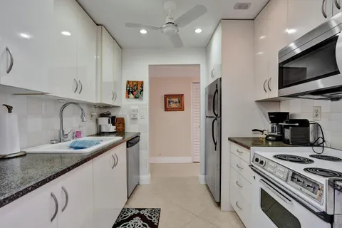 a kitchen with a stove and a refrigerator