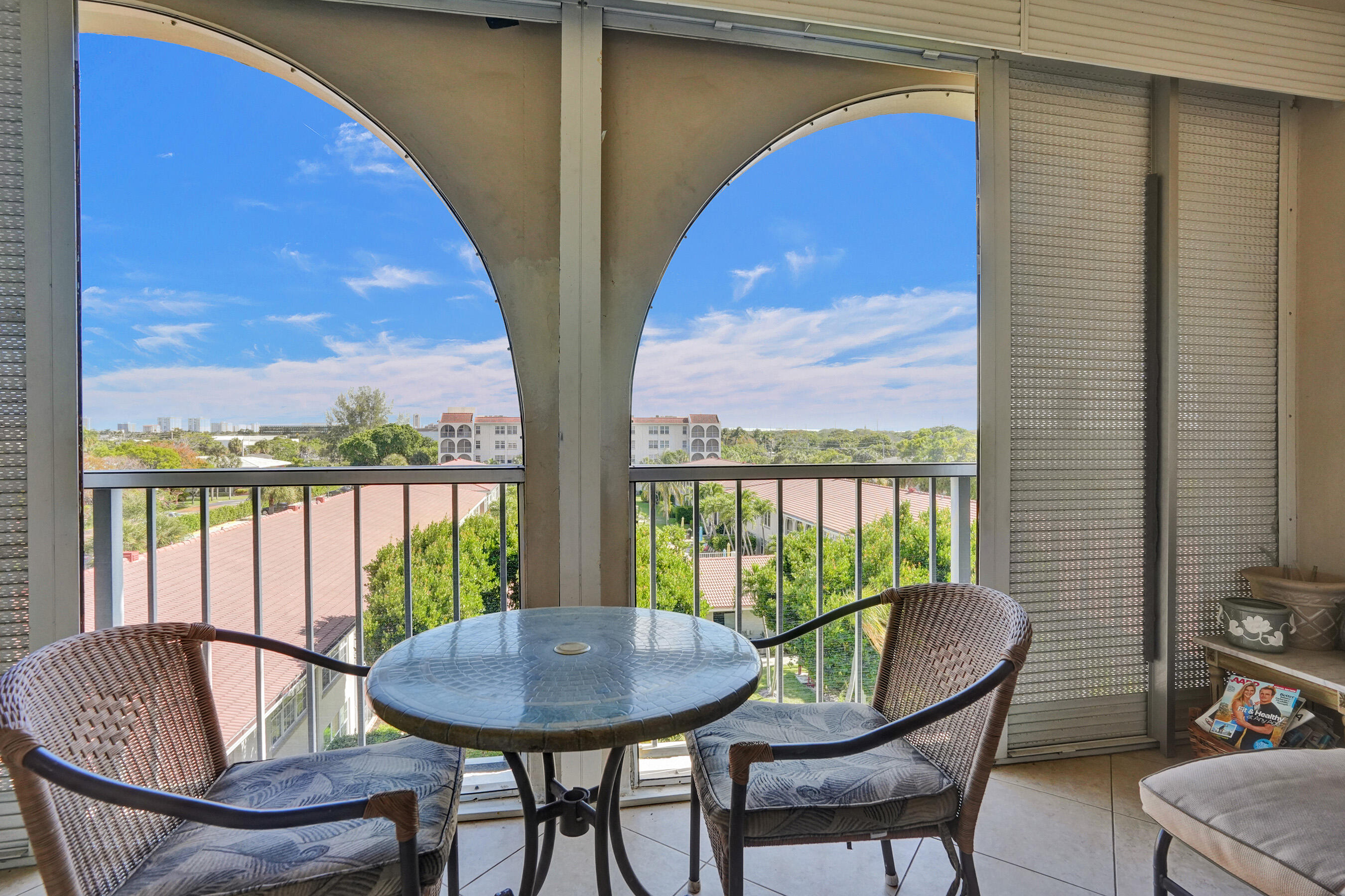 250 Northeast 20th Street, Unit 5060 Boca Raton, FL 33431 - Photo 17 of 36 a view of a balcony with furniture and a potted plant