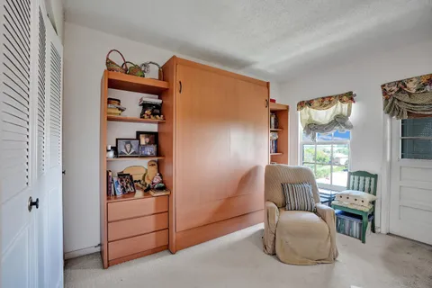 a bedroom with furniture and a bed