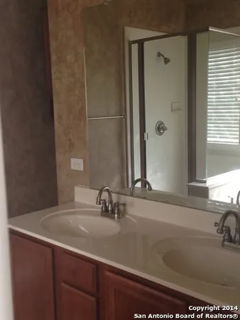 a close view of a sink and a mirror