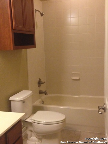157 Lone Star Boerne, TX 78006 - Photo 15 of 19 a white toilet sitting next to a bath tub