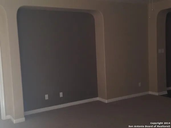 a view of a room that has a window in it