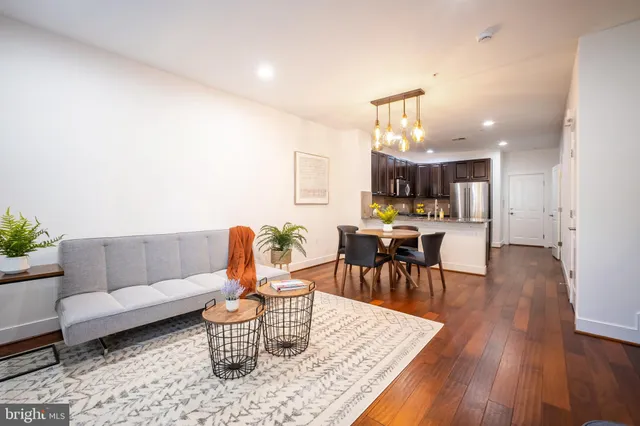 a view of a room with wooden floor