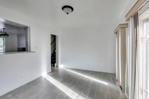 a kitchen with a stove sink and refrigerator
