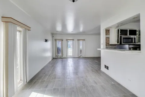 a kitchen with stainless steel appliances granite countertop a stove and a refrigerator