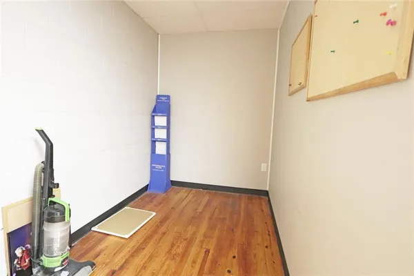 a view of a hallway view with wooden floor and staircase