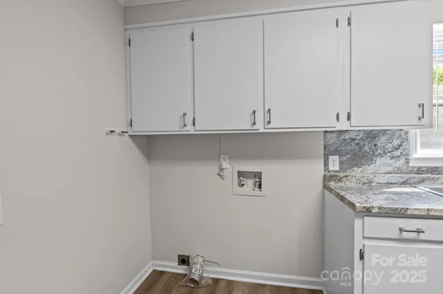 a view of cabinets and wooden floor