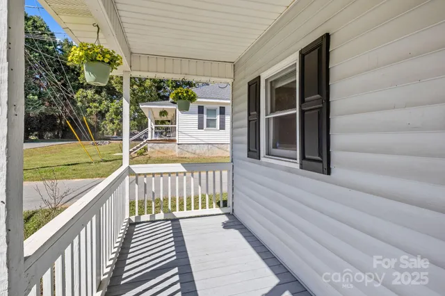 a view of a swimming pool with a porch