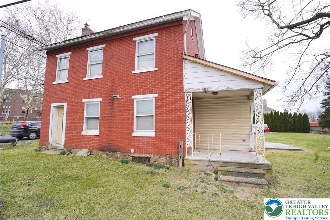 3863 Mauch Chunk Road Coplay, PA 18037 - Photo 2 of 33 a front view of a house with garden