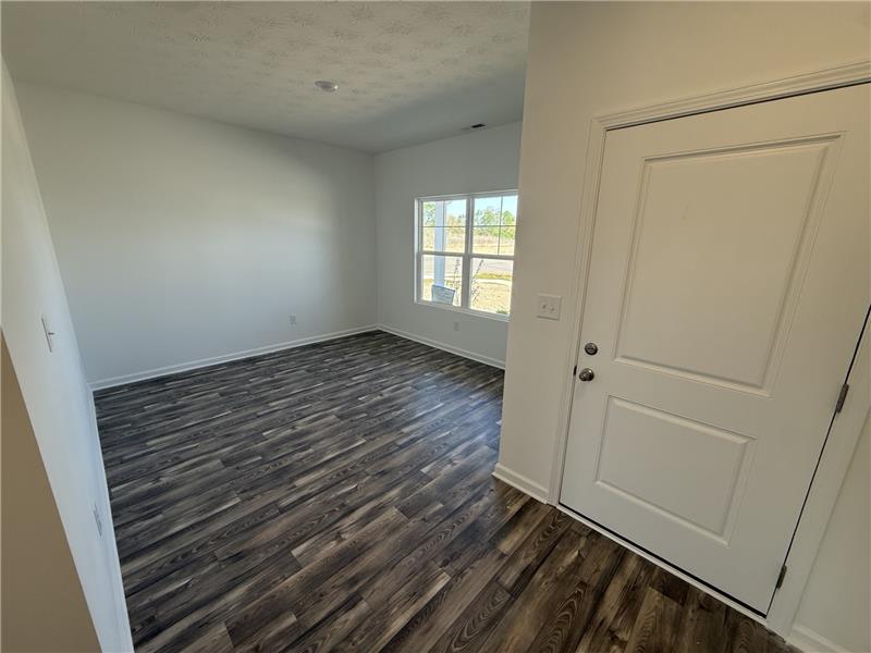 4001 Chakeres Avenue Springfield, OH 45505 - Photo 4 of 15 This inviting entrance features durable flooring and abundant natural light, creating a bright and welcoming atmosphere.