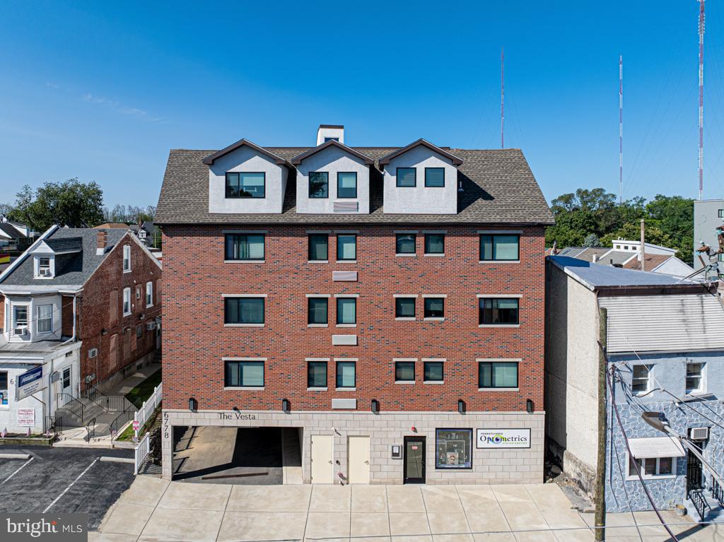 6778 Ridge Avenue, Unit 205 Philadelphia, PA 19128 - Photo 5 of 7 a front view of a multi story building