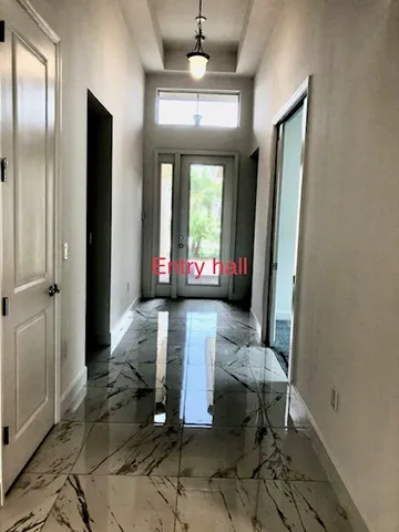 a bathroom with a shower and a sink