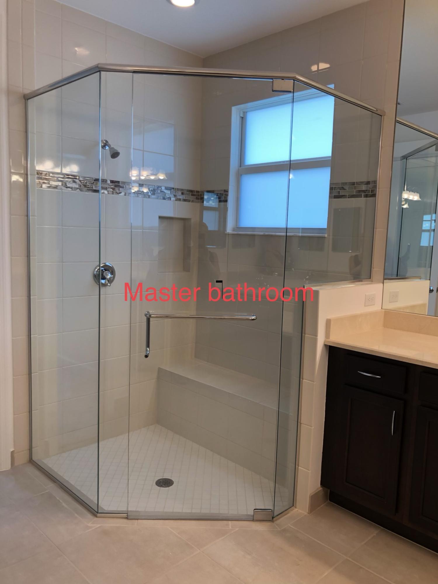 11670 Southwest Sailfish Isles Way Port St. Lucie, FL 34987 - Photo 17 of 25 a bathroom with a shower and a sink