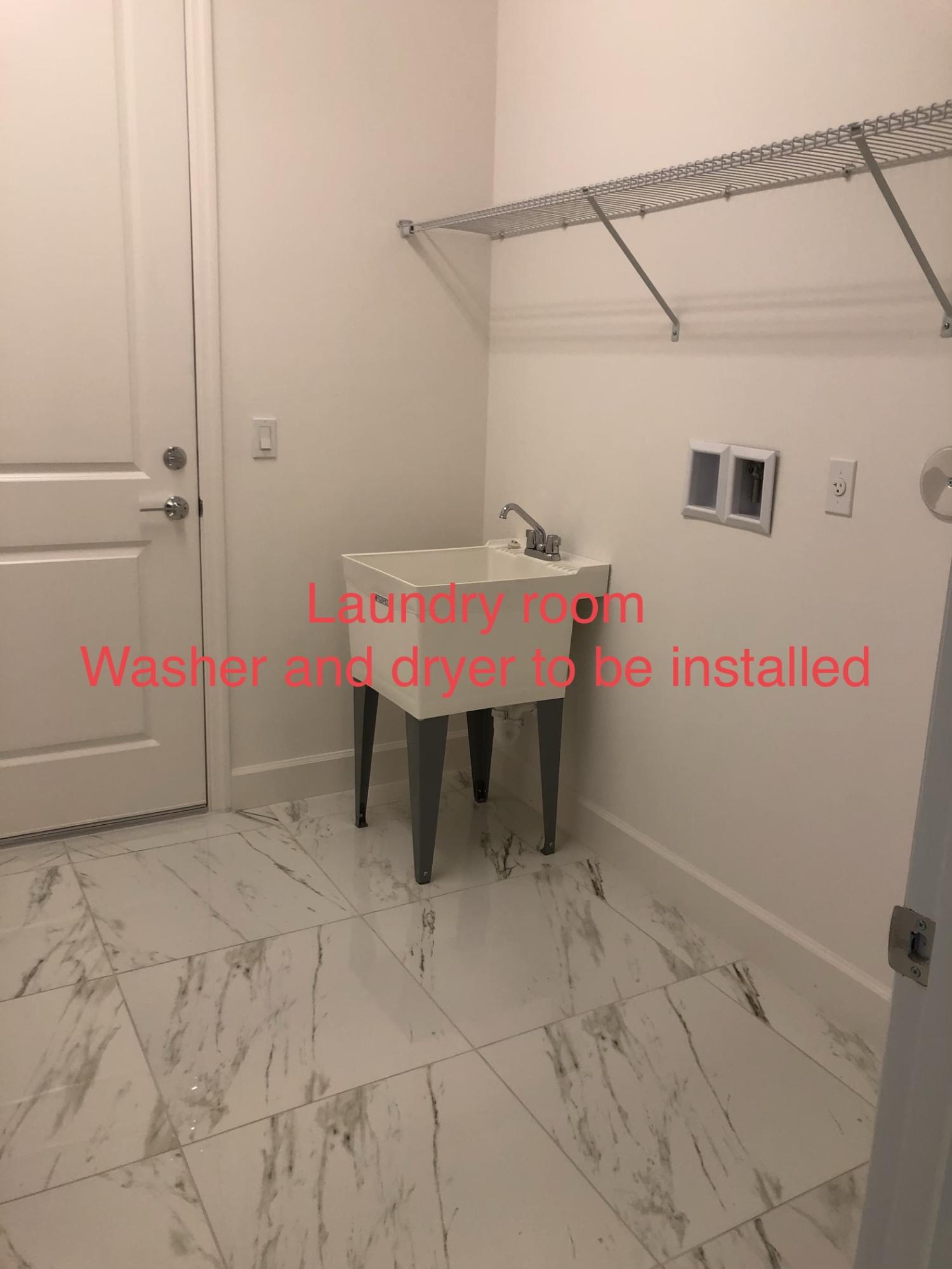 11670 Southwest Sailfish Isles Way Port St. Lucie, FL 34987 - Photo 23 of 25 a bed room with a bed and a table