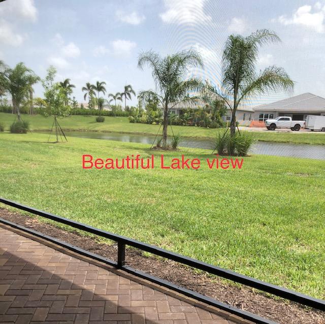 11670 Southwest Sailfish Isles Way Port St. Lucie, FL 34987 - Photo 3 of 25 a view of a park with palm trees