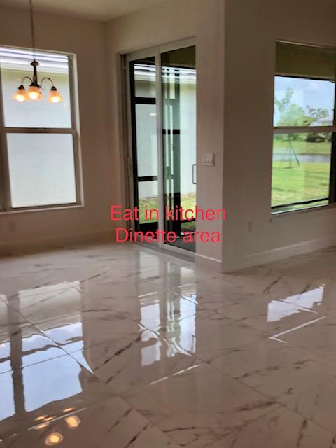 11670 Southwest Sailfish Isles Way Port St. Lucie, FL 34987 - Photo 10 of 25 a living room with a window