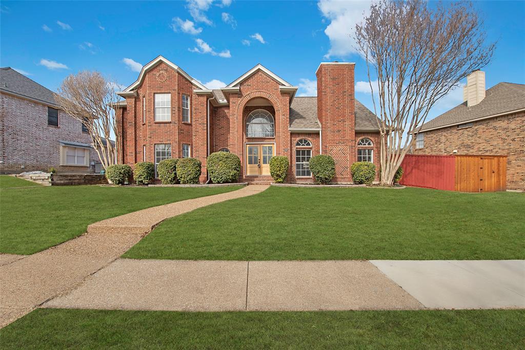 1917 Brabant Drive Plano, TX 75025 - Photo 1 of 1 View of front of home featuring a front lawn