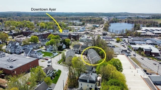 an aerial view of a house with outdoor space