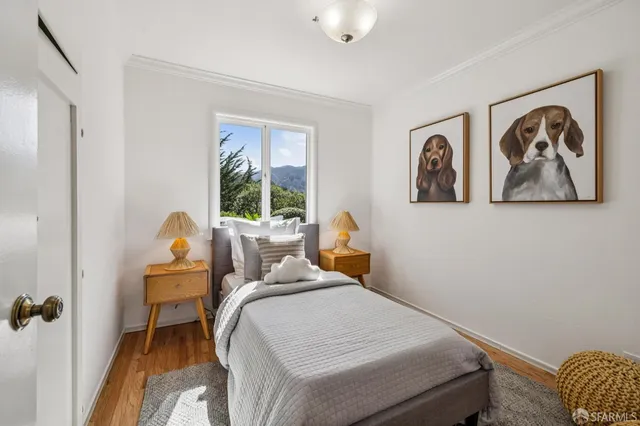 a bed room with a bed and a chair