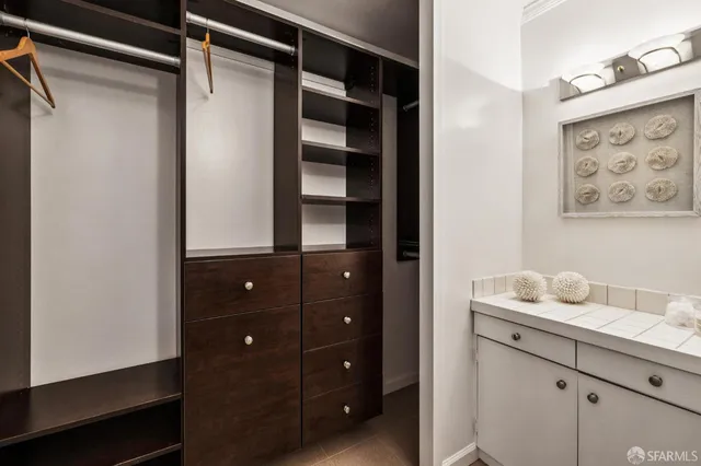 a bathroom with a shower vanity and sink