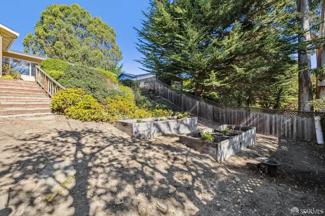 a backyard of a house with seating space