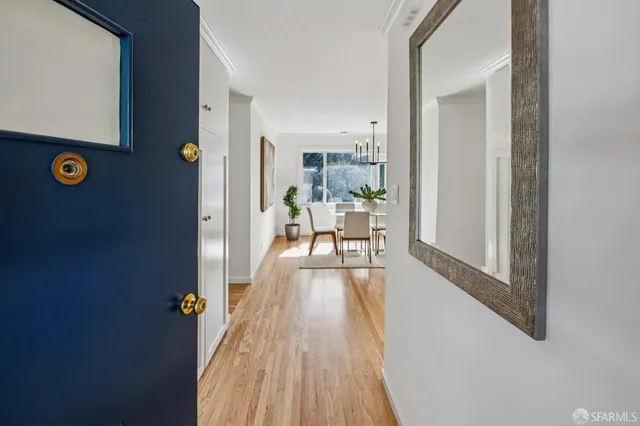 a view of a livingroom with furniture and hardwood floor