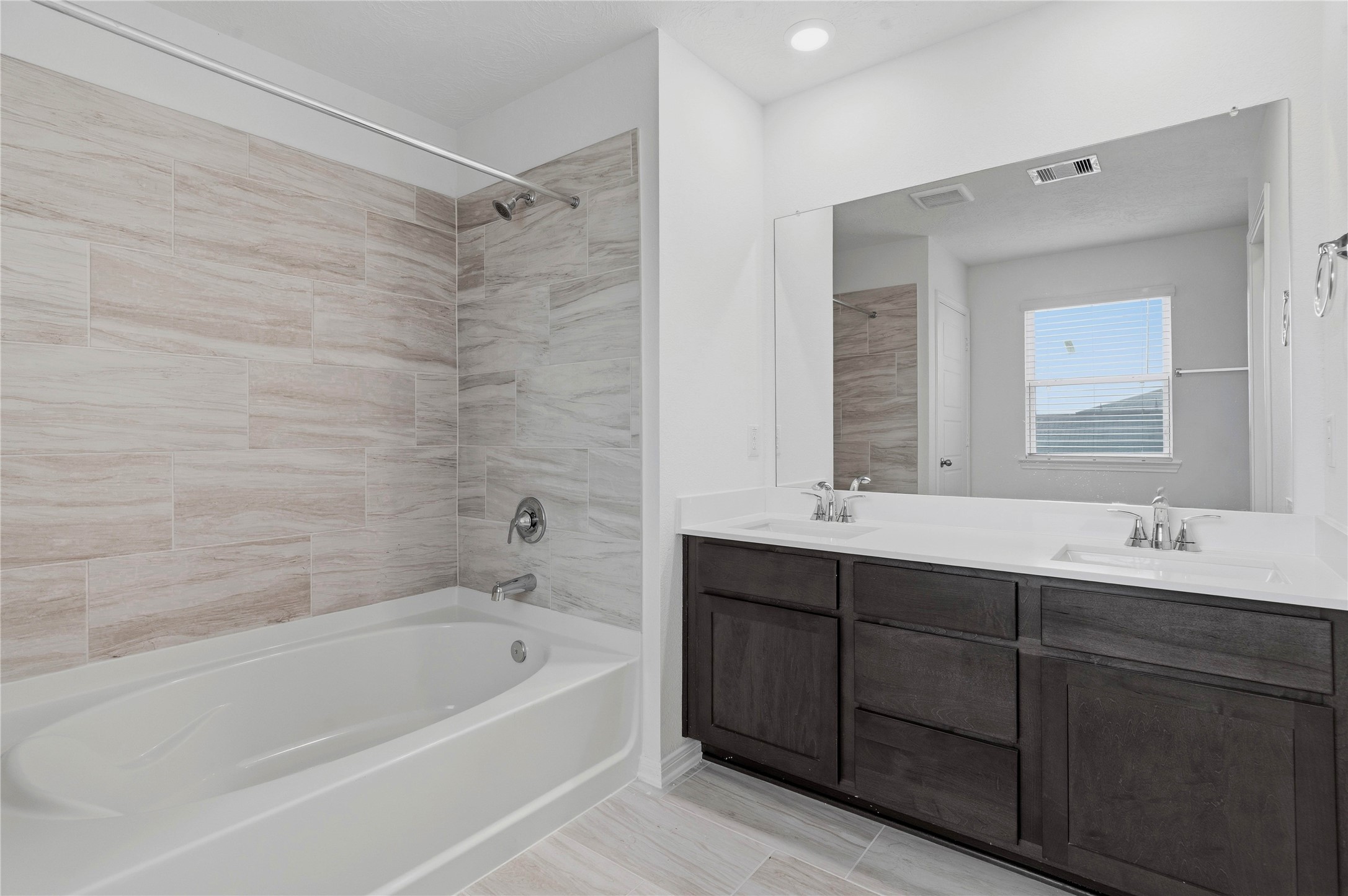 2503 Spruce Hl Road Beasley, TX 77417 - Photo 21 of 31 This stunning primary bathroom is truly move-in ready! It features stained cabinetry with light countertops, dual sinks, a large mirror, high ceilings, custom paint, a large window, and sleek modern finishes throughout.